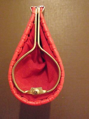 Small red wallet with gold clasp used