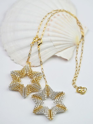 Necklace with two star pendants in white and gold custom made