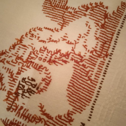 Handmade white embroidered table runner tzevres in terracotta-brown shades