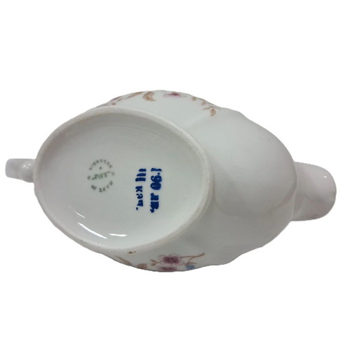 Vintage porcelain sauceboat with floral motif like new
