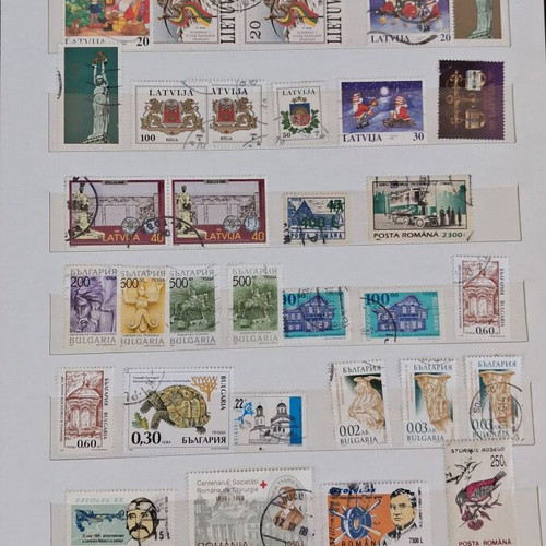 Stamp album used with 10 pages of foreign stamps 1960-1990