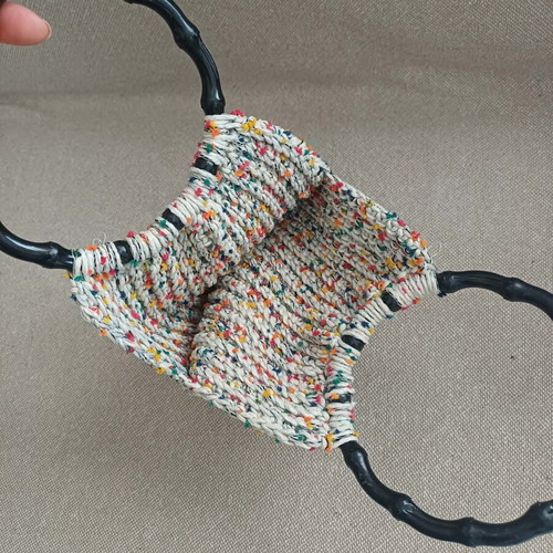 Handmade knitted bag with colorful details