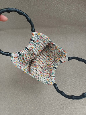 Handmade knitted bag with colorful details
