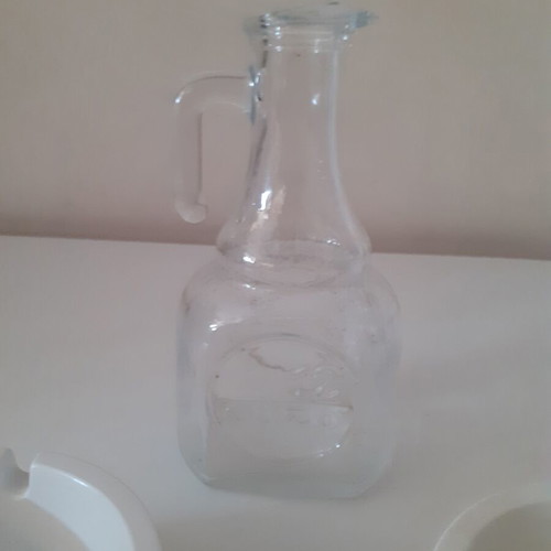 Ouzo 12 ashtrays and small jug like new