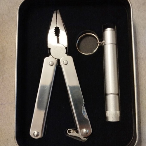 Multitool and flashlight set in metal box new unused