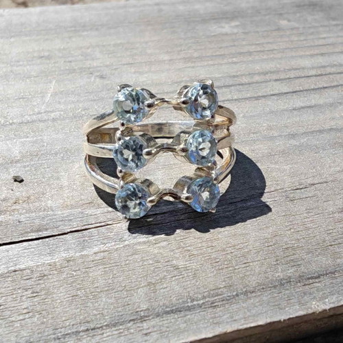 Silver ring with blue topaz