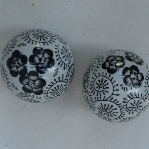 Vintage decorative porcelain spheres set like new with floral and geometric designs