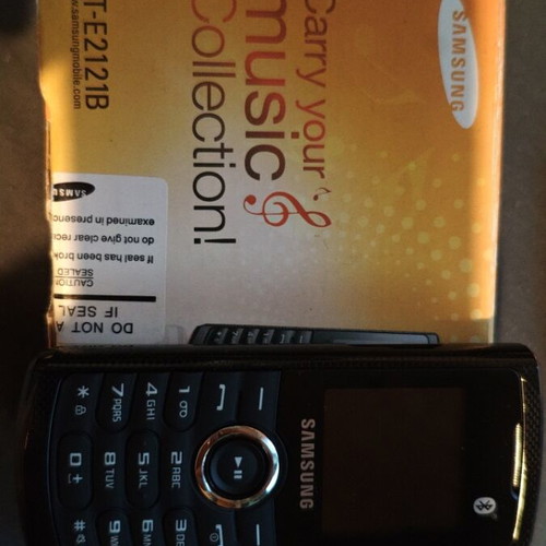 Samsung GT-E2121B mobile phone new with charger and headphones