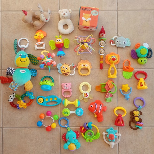 Set of 32 baby rattles including plush toys and large dice