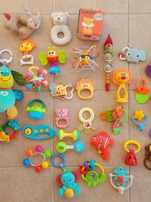 Set of 32 baby rattles including plush toys and large dice