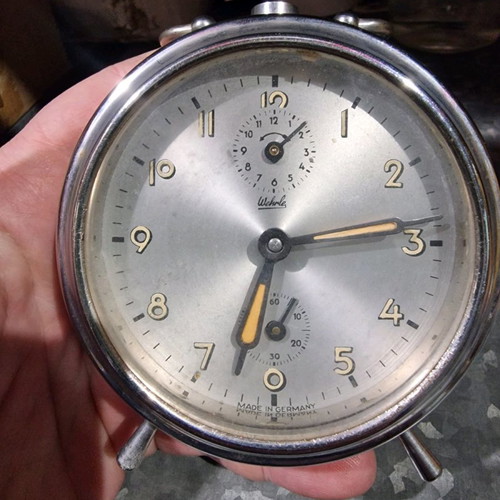 Wound analog table clock used for repair