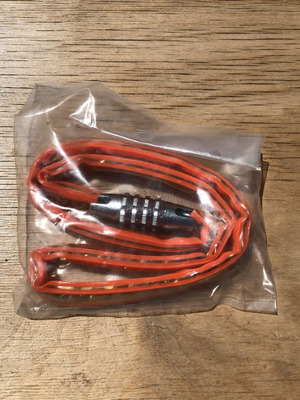 Vintage orange bicycle lock with gold chain and code 1143 new