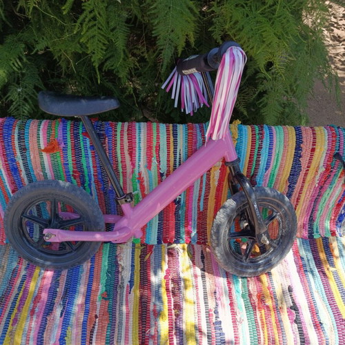 Strider balance bike pink used with height extension