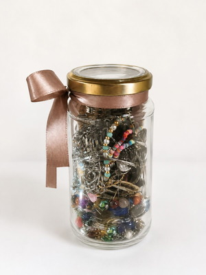 Jar with assorted jewelry