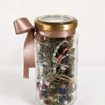 Jar with assorted jewelry