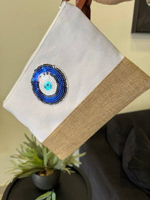 White envelope bag with blue eye and leather strap, new