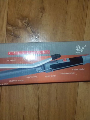 Hair curling iron slightly used in original box