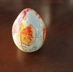 Hand-painted ceramic egg with floral and female figure design