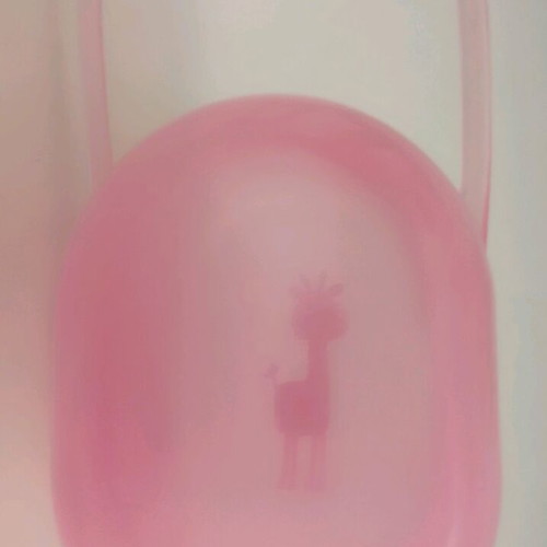 Plastic pacifier case used, pink with giraffe design