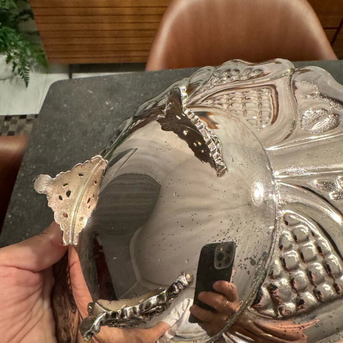 Vintage bowl with silver lining and engraved design, used
