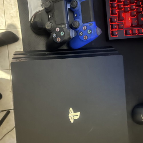 PlayStation 4 Pro 1TB with charging dock and 2 controllers like new