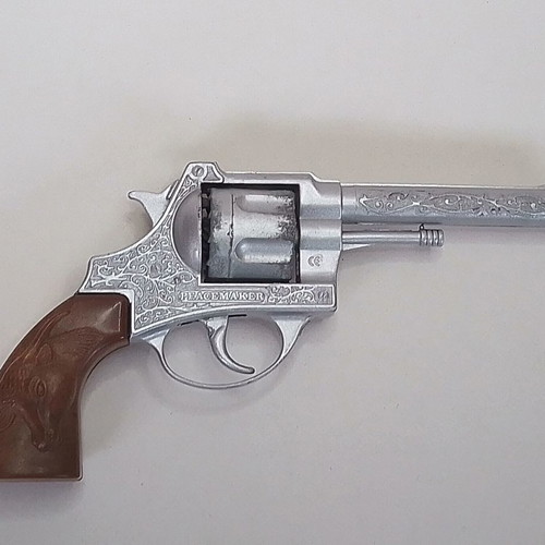 Vintage metal twelve-shot pistol Lone Star Peacemaker Colt 45 used
