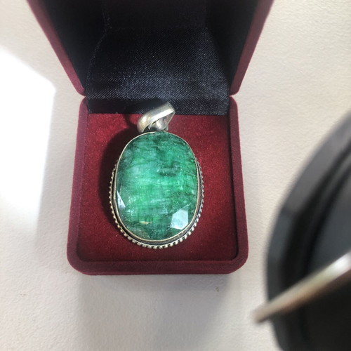 Necklace of smelted emerald like new with black ribbon
