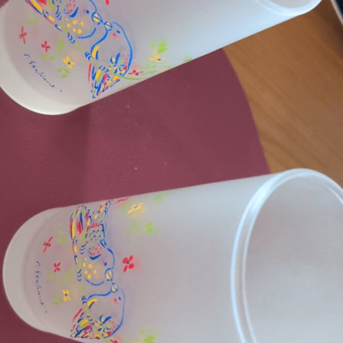 Glass pitcher and two glasses with Stathopoulos designs, like new
