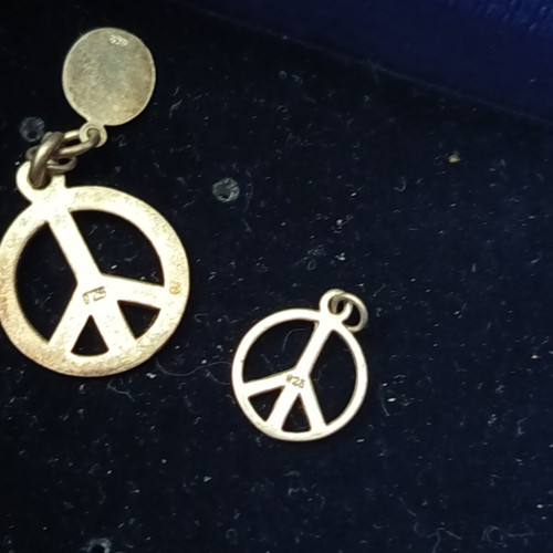 Peace symbol silver pendants set like new, two pieces