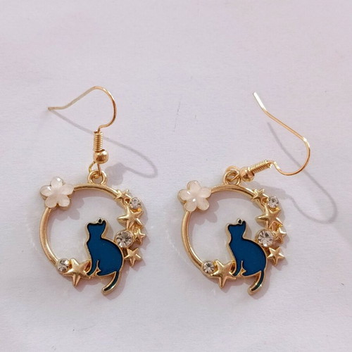 Earrings with blue cats in gold color