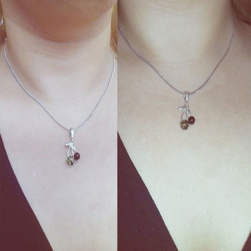 Silver cherry pendant new with brown and green amber