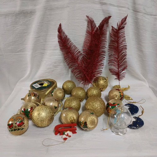 Christmas decorations like new, assorted ornaments and ribbon