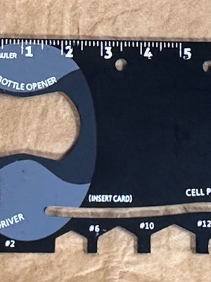 Metal multitool used, credit card size