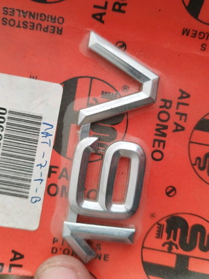 Alfa Romeo emblem new genuine in sealed packaging