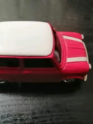 Mini Cooper miniature with clock used, red with white roof
