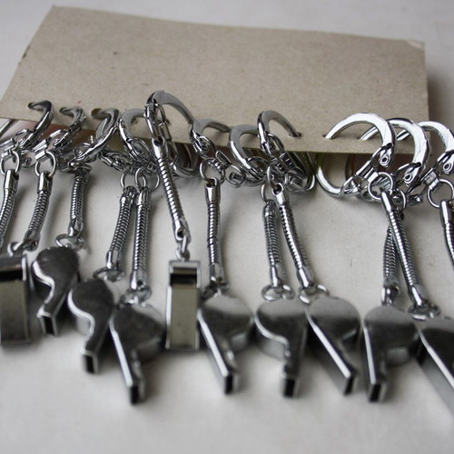 Card with 12 old metal whistle keychains from 1980s new