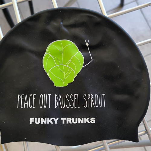 Three branded swimming caps
