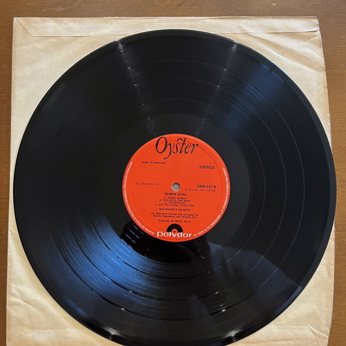 Rainbow Rising LP used with visible cover marks, excellent disc condition