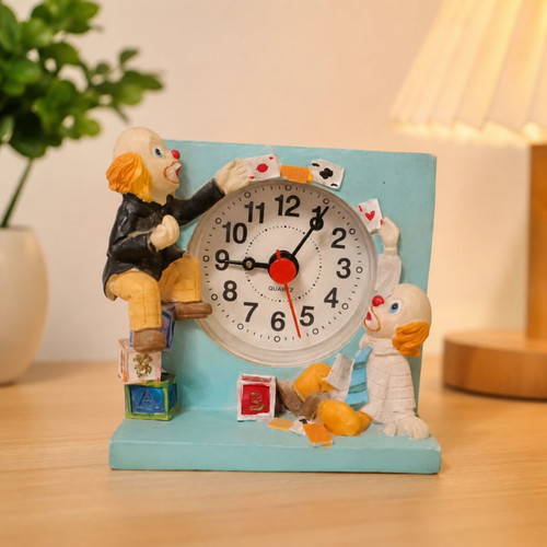 Vintage miniature table clock with clown and circus theme, used