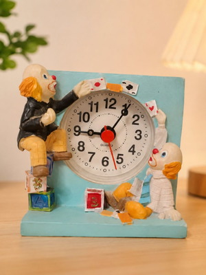 Vintage miniature table clock with clown and circus theme, used