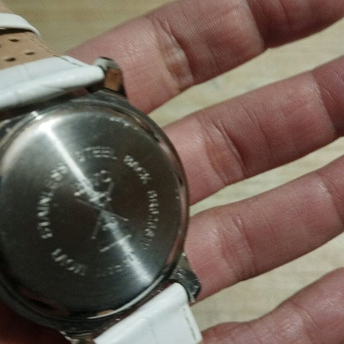 Women's watch used with white leather strap