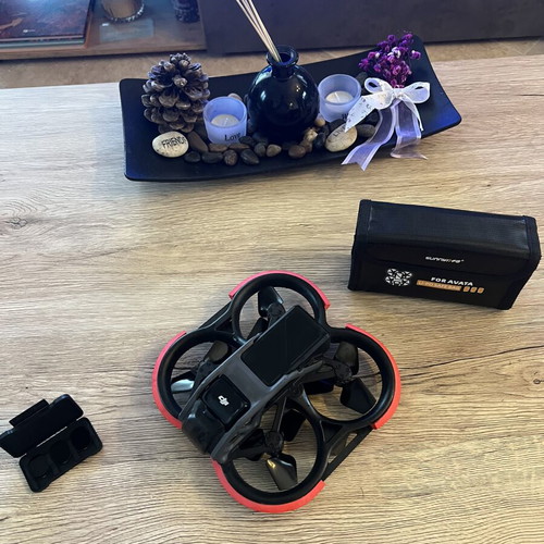 DJI Avata drone used with ND filters, 4 batteries, charger, and extras