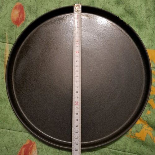 Porcelain plate used, black with small chip