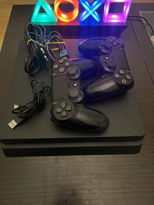 PlayStation 4 Slim 1TB with 2 Genuine Controllers and Cables, Like New
