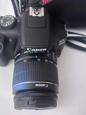 Canon EOS 2000D camera with case and tripod