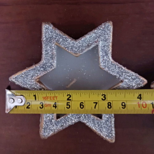 Christmas candles in clay stars with silver glitter new