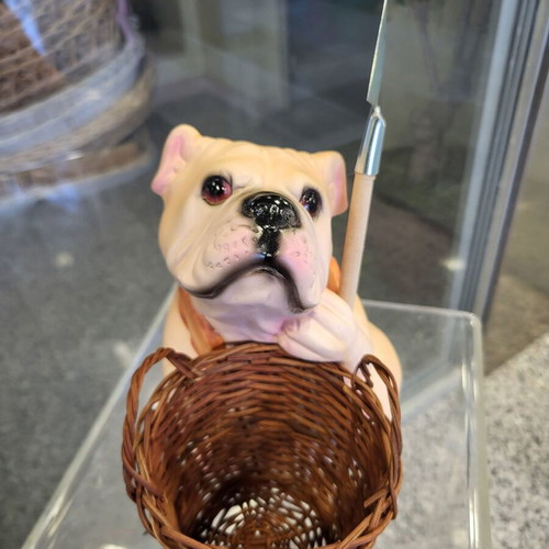 Decorative dog figure with basket