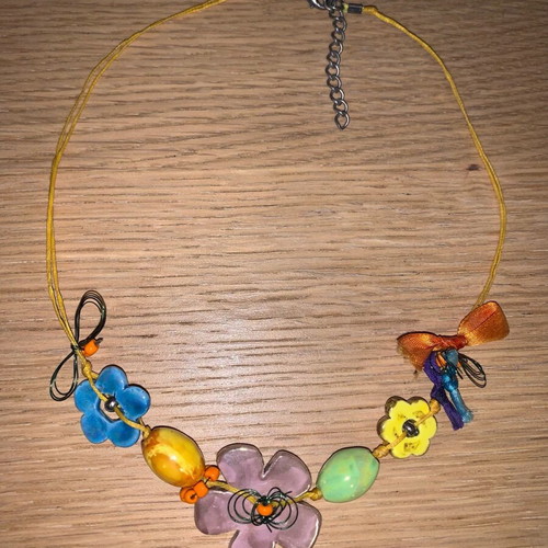 Chunky necklace used with floral metal and ceramic elements