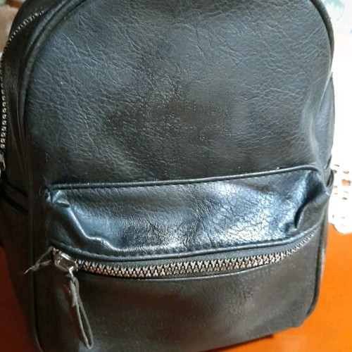 Backpack black medium made of eco leather with silver zippers like new
