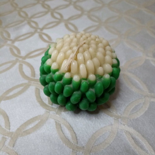 Green and ecru flower-shaped candle new